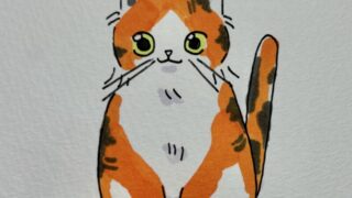 瞳が緑の三毛猫のイラスト